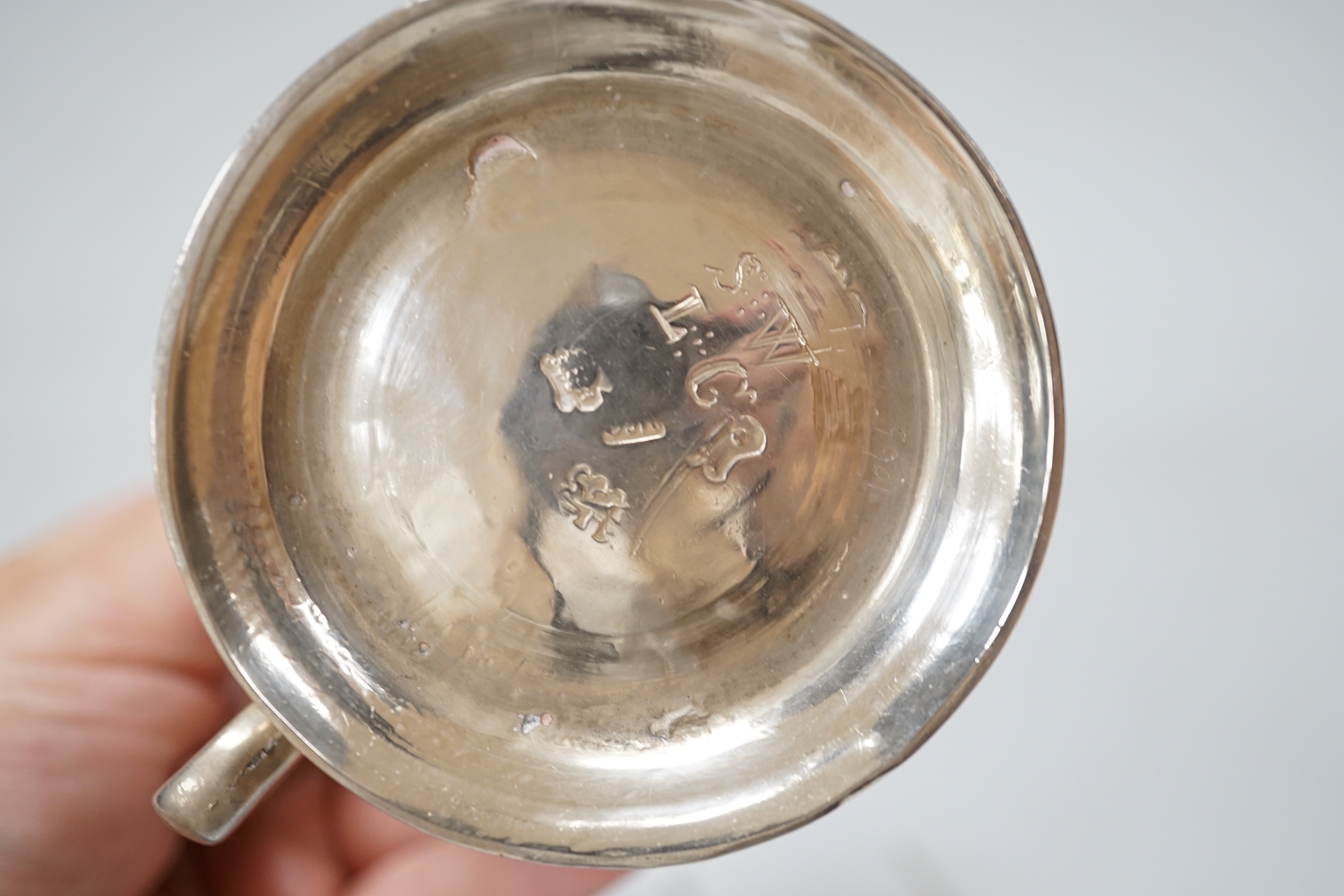 A George II silver baluster mug with scroll handle, makers mark rubbed, London 1752, 9cm, 160 grams
